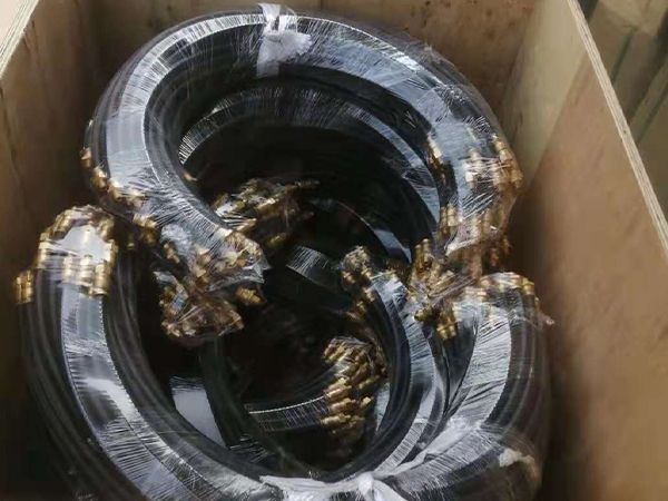 Hydraulic brake hose are packed with plastic film and placed in a wooden case.